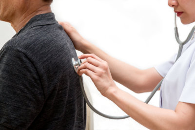 close up of Asian Nurse listen to elderly patient`s breath sound